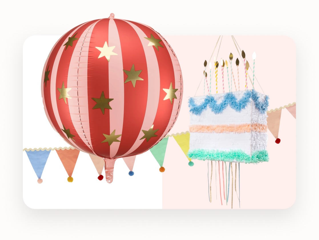 A private party room with a decorated table, bunting and balloons